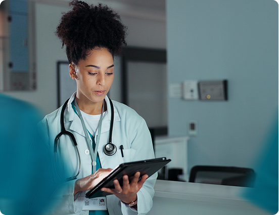 Clinician reviewing healthcare data on a tablet